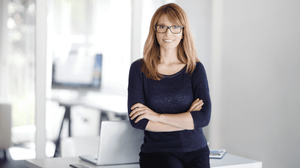 small-business-owner-standing-by-desk