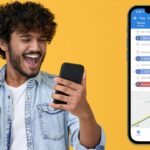 man holding phone happy to use mileage tracker app