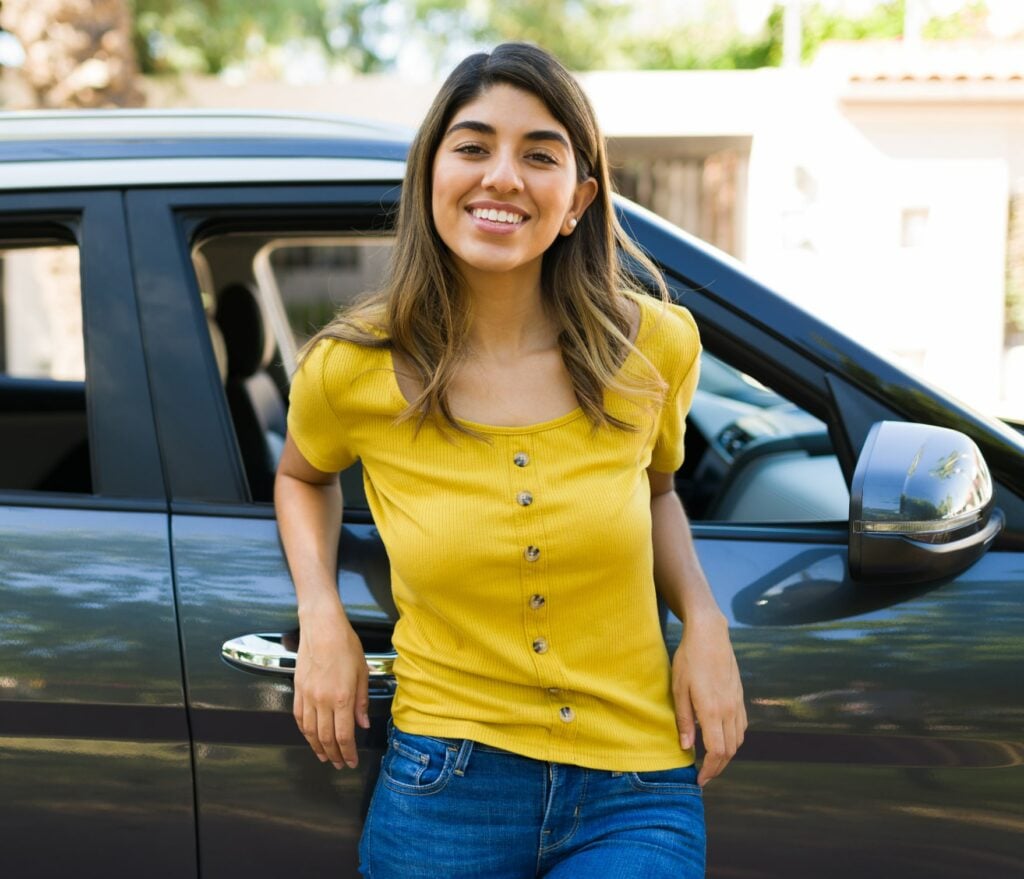 triplog user rideshare driver standing by their car
