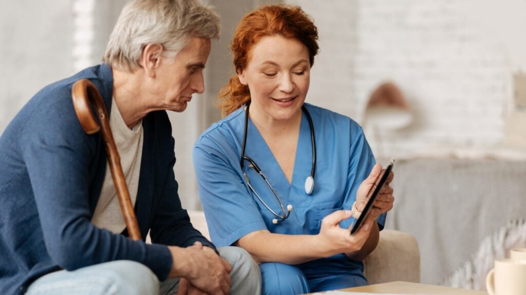 nurse at someone's house helping them