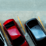 cars parked in a parking lot overhead photograph