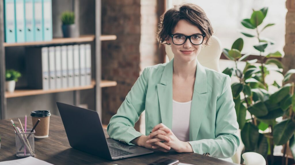 hr manager sitting at desk with laptop